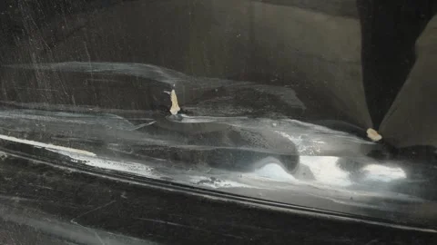 Deep scratches and paint damage on a black car bumper Stock Footage 340154495