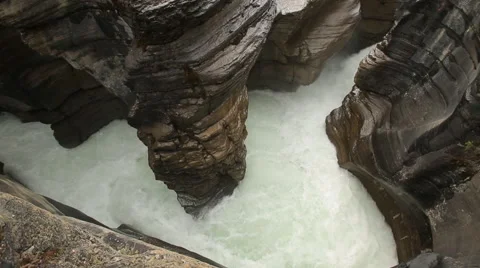 DEEP SLOT CANYON WITH WATER CHURNING THROUGH Stock Footage 59073326