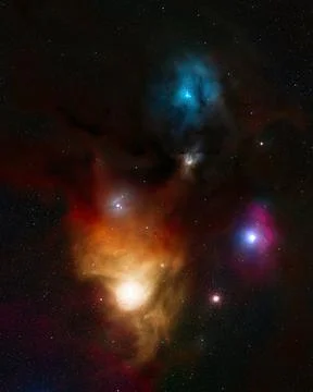 A deep space view features colorful gas clouds in blue, orange, and magenta Stock Photos