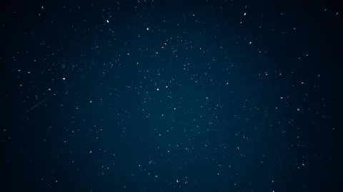 Deep starry night sky with bright stars and meteor Stock Photos