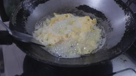 Deep Stir Frying Cooking Egg In Hot Oil Wok, Thai Asian Style Omelette Stock Footage 237587652