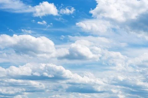 Deep sunny sky background whith white clouds Stock Photos
