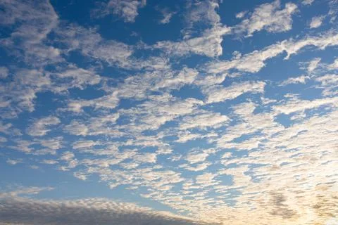 A deep sunset blue sky with clouds. Russia. Stock Photos