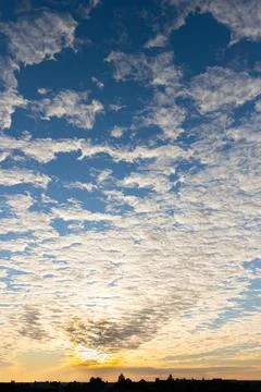 A deep sunset blue sky with clouds. Russia. Stock Photos