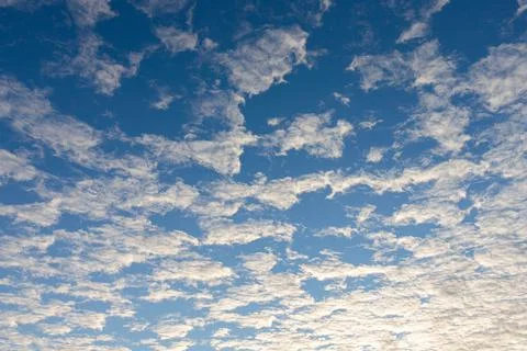 A deep sunset blue sky with clouds. Russia. Stock Photos