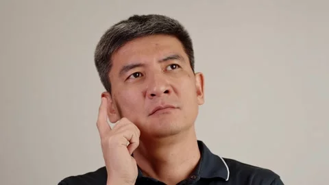 Deep thought expression portrait of man thinking with hand on face Stock Footage 322121807