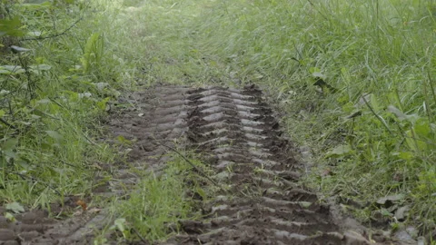 Deep trail made with tractor tire pattern 4K video Stock Footage 211894239