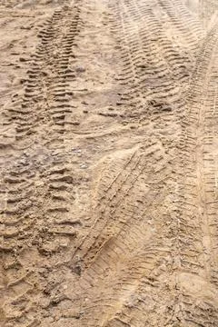 Deep tread marks from construction equipment or a heavy loader. Texture of .. Stock Photos