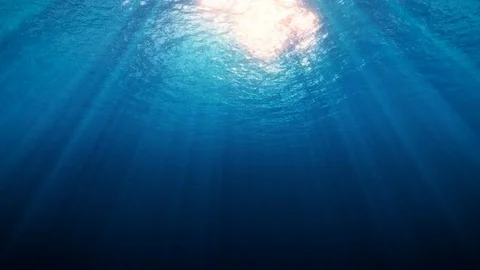 Deep Underwater with Sun Red Rays Stock Footage