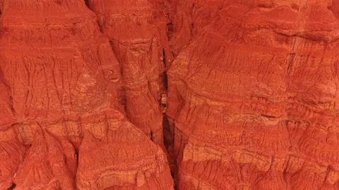 Deep vertical fissure inside eroded clay cliffs, Teruel, Spain. Close drone shot Video stock 336385252