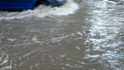 Deep water on car road after heavy rain in summer time Stock-Footage 140766429