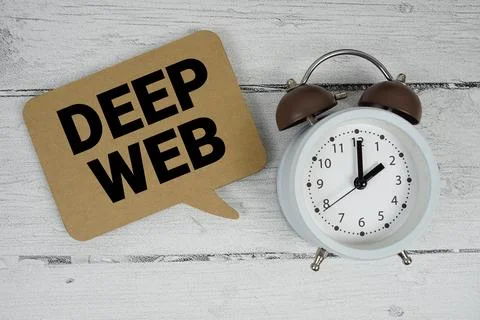 Deep Web text with alarm clock on wooden background Stock Photos