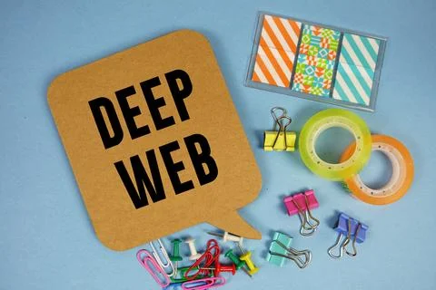 Deep web text with stationery on blue background Stock Photos