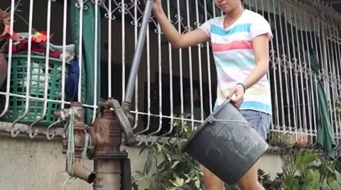 Deep Well Water pump operator Stock Footage