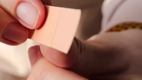 Deep wound on thumb from knife cut. Applying sterile medical patch Stock Footage 292245841