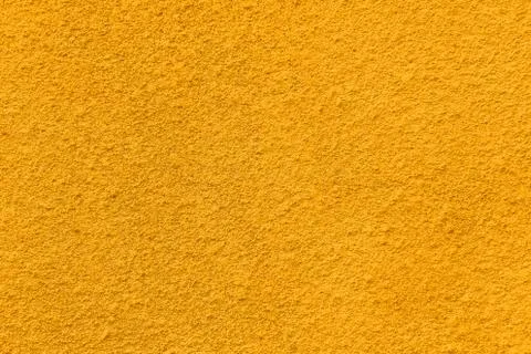 Deep yellow coarse plaster texture Stock Photos