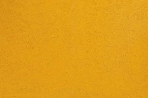 Deep yellow coarse plaster wall Stock Photos
