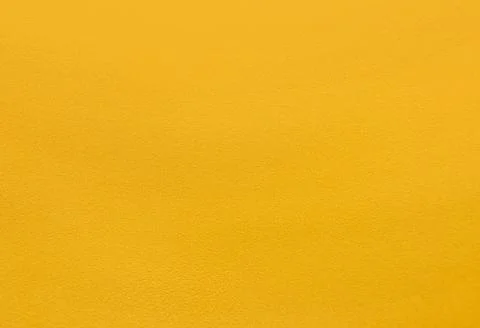 Deep yellow coarse plaster wall Stock Photos