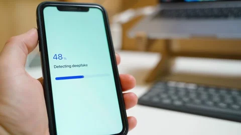 Deepfake detection scan on smartphone screen. Deepfake detected warning appears Видео 343237989