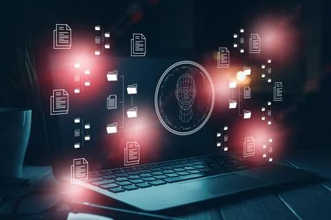 Deepfake technology on a laptop with digital elements Stock Photos