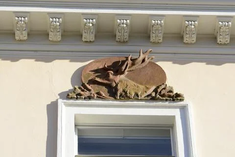 Deer bas-relief over the window. Baden near Vienna. Vein. Austria Stock Photos