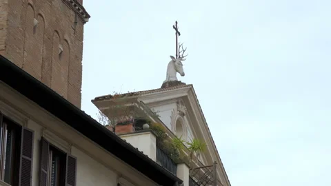 A deer head with a cross between the antlers of the roman church Sant'Eustachio Stock Footage 152986629