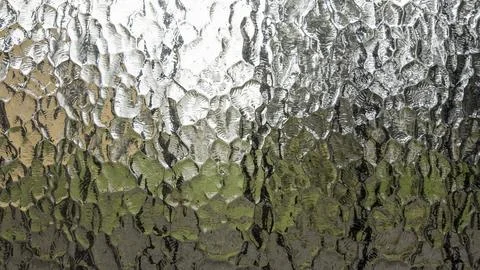 Default Close-up of textured glass surface forming an abstract pattern, disto Stock Photos