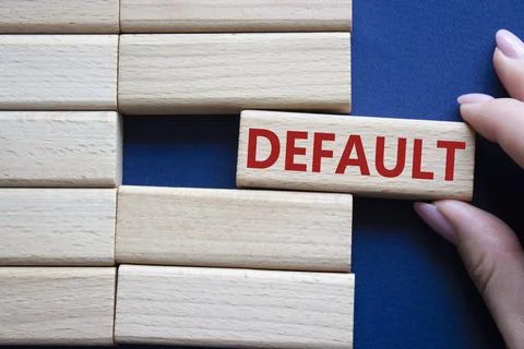 Default symbol. Concept word Default on wooden blocks. Businessman hand. Beau Stock Photos