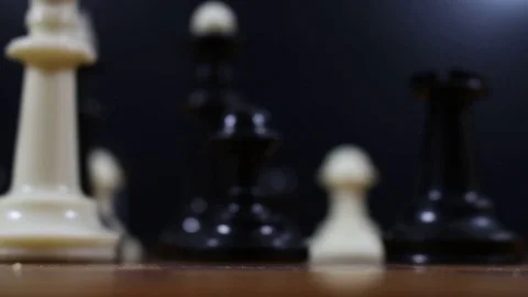 Defeated white King falls on the chessboard Stock Footage 77279213