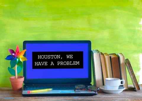 Defect laptop computer in home office,  message Houston We Have A Problem Stock Photos