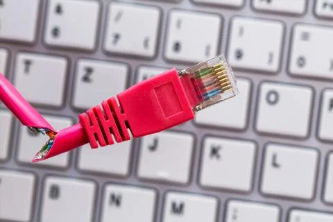 Defective network cable on keyboard Stock Photos