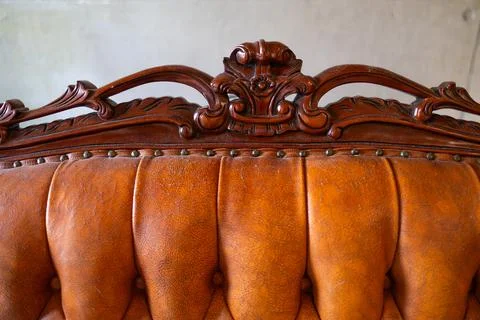 Defects on a leather sofa. Damaged to leather furniture. Stock Photos