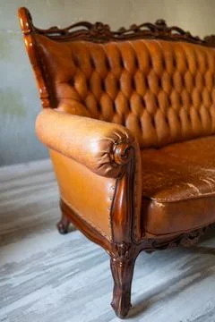 Defects on a leather sofa. Damaged to leather furniture. Stock Photos