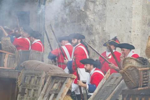 Defence and attack the castle during the re-enactment of the war of successio Stock Photos