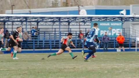 Defender tries to catch a player with a ball - Slow motion Stock Footage 89740780