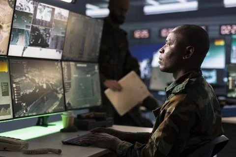 Defense security expert using satellite hardware to track dangerous threats Stock Photos