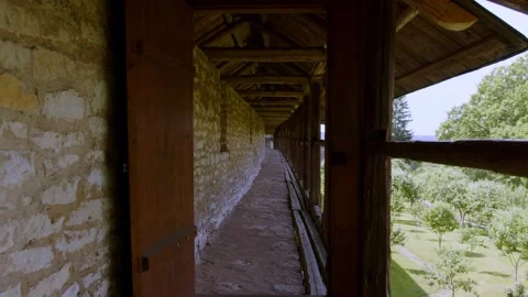 A defense wall in a medieval castle. A corridor in a castle. A walk along the Stock Footage 253499608