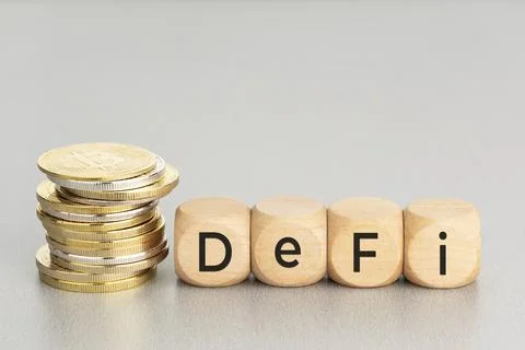 DEFI Cryptocurrency concept. Stacked crypto coins and wooden blocks with text. Foto stock