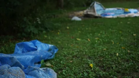 Deflated or Broken Pool Series - Bubble Wrap Tarp Near old Pool Video stock 346567139