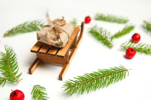 Defocu gift composition. Wrapped craft vintage gift boxes lying wooden toy sl Stock Photos