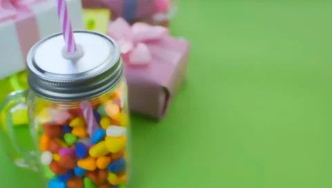 Defocus Banner Festive composition set of gift boxes with balls candy cocktai Stock Photos