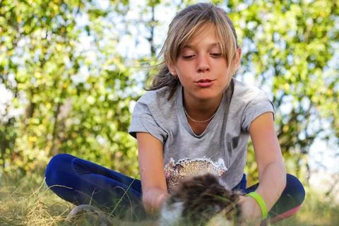 Defocus blonde little expression girl playing and caress cat, black and white Stock Photos
