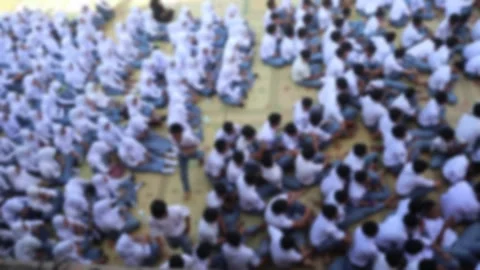 Defocus blur of school students gathering in the schoolyard. Stock Footage 343827612
