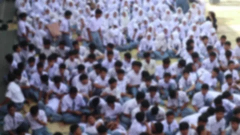 Defocus blur of school students gathering in the schoolyard. Stock Footage 343827861