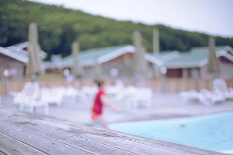 Defocus blurred background recreation base wooden houses pool sunbeds wooden Stock Photos