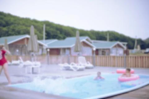 Defocus blurred background recreation base wooden houses pool sunbeds wooden  Stock Photos
