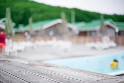 Defocus blurred background recreation base wooden houses pool sunbeds wooden Stock Photos