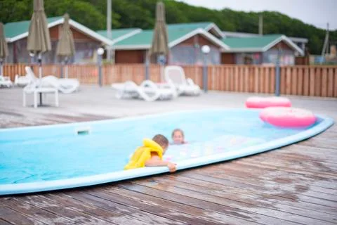 Defocus blurred background recreation base wooden houses pool sunbeds wooden  Stock Photos