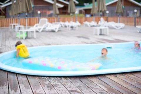 Defocus blurred background recreation base wooden houses pool sunbeds wooden  Stock Photos
