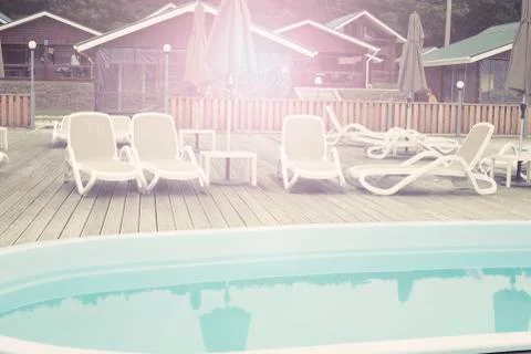 Defocus blurred background recreation base wooden houses pool sunbeds wooden  Stock Photos